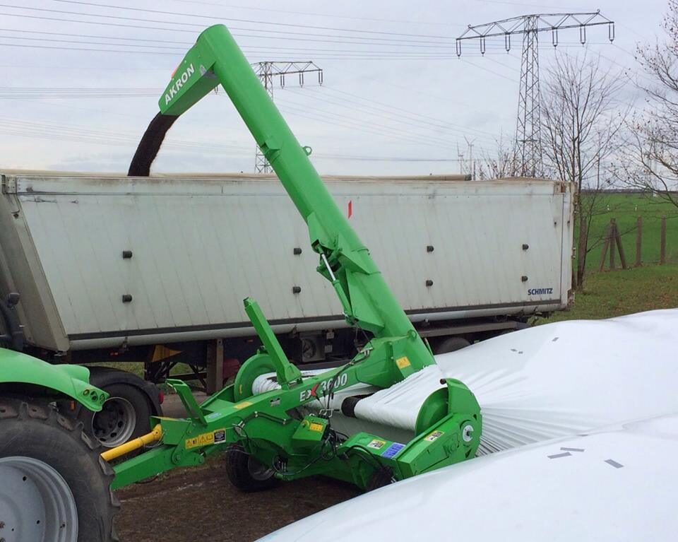 Auger loading grain into sealed bulk storage